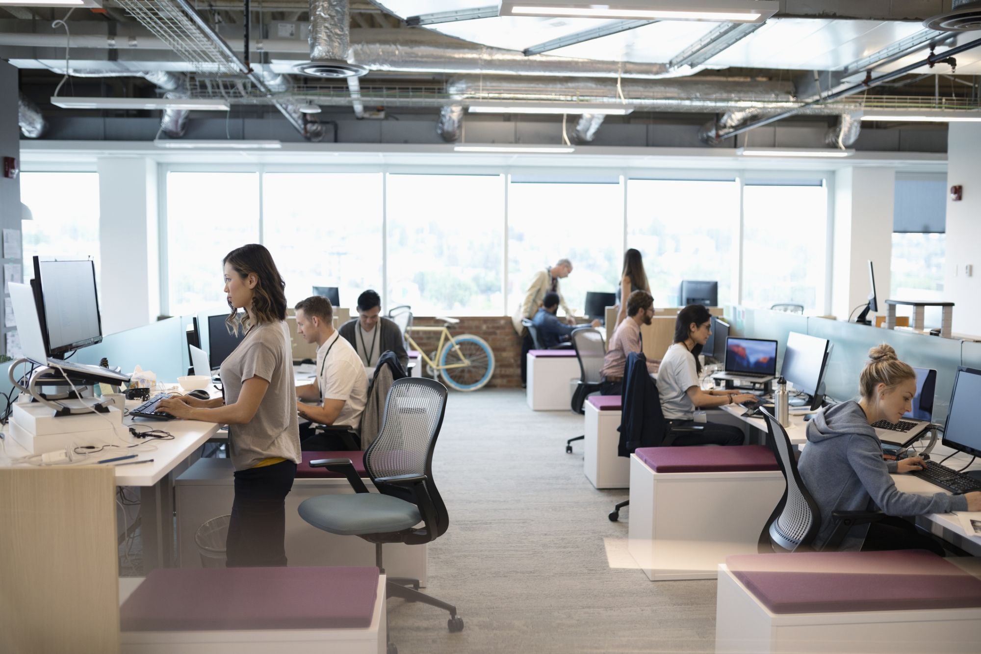 a group of people working at computers