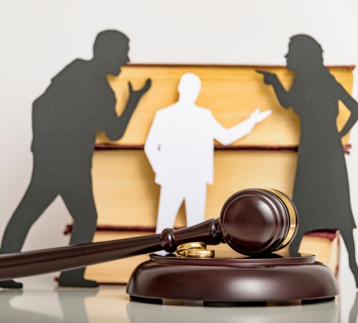 a gavel and rings on a wooden stand